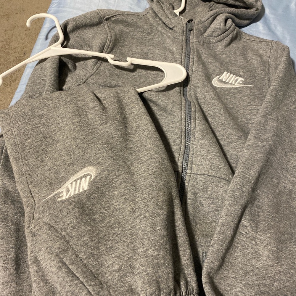 Nike two piece, size L in the jacket and a medium in the sweatpants